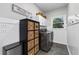 Practical laundry area with washer, dryer, storage, and modern decor at 10880 Windham Way, Alpharetta, GA 30022