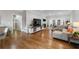Bright and airy living room featuring hardwood floors and a cozy seating area with natural light at 10880 Windham Way, Alpharetta, GA 30022
