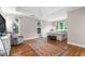 Inviting main bedroom showcasing hardwood floors, neutral tones, and ample natural light at 10880 Windham Way, Alpharetta, GA 30022