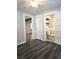 A bedroom leading into the bathroom showcases wood-look floors and neutral paint at 1341 Se Joyner Se Ave, Marietta, GA 30060