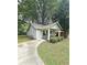 Charming single-story home featuring a covered porch with a swing, neat landscaping, and a paved driveway at 1341 Se Joyner Se Ave, Marietta, GA 30060