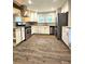Recently remodeled kitchen with stainless appliances, stone counters, modern hardware, and wood-look flooring at 1341 Se Joyner Se Ave, Marietta, GA 30060