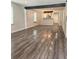 Open-concept living room featuring wood-look floors, neutral paint and a dark accent beam in the ceiling at 1341 Se Joyner Se Ave, Marietta, GA 30060