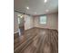 The living room features wood-look flooring, neutral paint and a doorway with a modern, white barn door at 1341 Se Joyner Se Ave, Marietta, GA 30060
