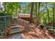 Backyard featuring stone steps, a patio, and outdoor playset at 620 Amberidge Trl, Atlanta, GA 30328