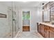 Beautiful bathroom with glass shower and wood vanity at 620 Amberidge Trl, Atlanta, GA 30328