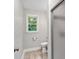 Bright bathroom featuring a shower with glass door and window view at 620 Amberidge Trl, Atlanta, GA 30328