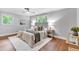 Comfortable bedroom with ceiling fan, hardwood floors, and natural light at 620 Amberidge Trl, Atlanta, GA 30328
