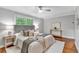 Cozy bedroom with hardwood floors, ceiling fan, and natural light at 620 Amberidge Trl, Atlanta, GA 30328