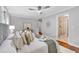 Spacious bedroom features hardwood floors, ceiling fan, and en suite bath at 620 Amberidge Trl, Atlanta, GA 30328