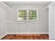 Walk-in closet with window, hardwood floors, built-in shelves and rods at 620 Amberidge Trl, Atlanta, GA 30328