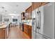 Beautiful kitchen with stainless appliances, wood cabinets, stone countertops, and eat-in dining area at 620 Amberidge Trl, Atlanta, GA 30328