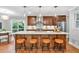 Modern kitchen with a large island, stylish pendant lights, and stainless steel appliances at 620 Amberidge Trl, Atlanta, GA 30328