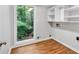 Spacious laundry room with ample storage and scenic window view at 620 Amberidge Trl, Atlanta, GA 30328
