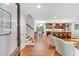 Bright, open living area seamlessly connects to a modern kitchen with hardwood flooring and neutral color palette at 620 Amberidge Trl, Atlanta, GA 30328