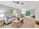 Bright living room with multiple windows, ceiling fans and neutral colors at 620 Amberidge Trl, Atlanta, GA 30328