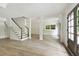 Finished basement with wood floors, stairway, and access to the outdoors, featuring double doors at 2973 Payton Ne Rd, Atlanta, GA 30345