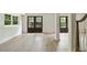 Finished basement features stylish wood-look flooring, double doors to the exterior, and natural light at 2973 Payton Ne Rd, Atlanta, GA 30345