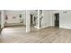 Open basement space featuring modern floors, wainscoting details, and convenient mudroom storage at 2973 Payton Ne Rd, Atlanta, GA 30345