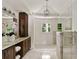 Bright bathroom showcasing a double sink vanity with dark wood cabinets and a separate shower at 2973 Payton Ne Rd, Atlanta, GA 30345