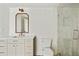 Bright bathroom featuring a modern vanity, beautiful mirror and glass shower with tiled walls at 2973 Payton Ne Rd, Atlanta, GA 30345