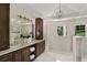 Spacious bathroom showcasing a double sink vanity with dark wood cabinets and a separate shower at 2973 Payton Ne Rd, Atlanta, GA 30345