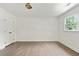 Spacious bedroom with hardwood floors, closet, large window, and bright, neutral paint at 2973 Payton Ne Rd, Atlanta, GA 30345