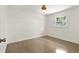 Bright bedroom with hardwood floors, a window, and neutral paint at 2973 Payton Ne Rd, Atlanta, GA 30345