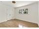 Bright bedroom featuring hardwood floors, a window, and closet at 2973 Payton Ne Rd, Atlanta, GA 30345
