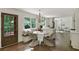 Bright breakfast nook next to kitchen with banquette seating and view of yard through the window at 2973 Payton Ne Rd, Atlanta, GA 30345