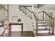 Bright entryway featuring a staircase with wood and white trim, and a view into other rooms at 2973 Payton Ne Rd, Atlanta, GA 30345