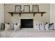 Close-up of the fireplace with a wooden mantel and a set of pillows at 2973 Payton Ne Rd, Atlanta, GA 30345