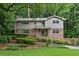 Charming two-story home with a well-manicured lawn and mature landscaping, creating inviting curb appeal at 2973 Payton Ne Rd, Atlanta, GA 30345