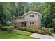 Charming two-story home with a well-manicured lawn and mature landscaping, creating inviting curb appeal at 2973 Payton Ne Rd, Atlanta, GA 30345