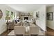 Cozy living room featuring a fireplace, a large window, and comfortable seating at 2973 Payton Ne Rd, Atlanta, GA 30345
