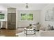 Living room and kitchen features stainless steel refrigerator and comfortable seating area at 2973 Payton Ne Rd, Atlanta, GA 30345