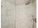 Close-up of a modern shower featuring neutral tile, a shower head and a built-in niche at 2973 Payton Ne Rd, Atlanta, GA 30345