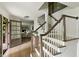 Elegant staircase with wood and white trim, leading to the upper level, with open view of the front door at 2973 Payton Ne Rd, Atlanta, GA 30345