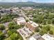 Expansive aerial view showcases the building's location within a lush, green landscape with mountain backdrop at 326 Roswell Se St # 406, Marietta, GA 30060