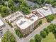Aerial view of a brick apartment complex with parking and green space at 326 Roswell Se St # 406, Marietta, GA 30060