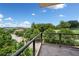Balcony with a scenic view overlooking green trees, buildings, and a beautiful blue sky at 326 Roswell Se St # 406, Marietta, GA 30060