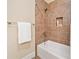 Bathroom featuring a bathtub with tiled walls and a shower niche at 326 Roswell Se St # 406, Marietta, GA 30060