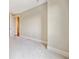 Spacious carpeted bedroom features neutral paint and base molding and bright doorway at 326 Roswell Se St # 406, Marietta, GA 30060