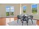 Dining room features a black table for four, and large windows with a great outdoor view at 326 Roswell Se St # 406, Marietta, GA 30060
