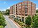 Exterior view of an apartment building with balconies and landscaping at 326 Roswell Se St # 406, Marietta, GA 30060