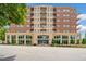 Exterior view of an apartment complex with a street in the foreground at 326 Roswell Se St # 406, Marietta, GA 30060