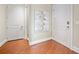 Hallway with hardwood floors, neutral paint, and a modern art piece at 326 Roswell Se St # 406, Marietta, GA 30060