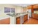 Kitchen with stainless steel appliances, beautiful wood cabinets, and eat-in counter space at 326 Roswell Se St # 406, Marietta, GA 30060