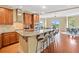 Open kitchen and dining area with hardwood floors, stainless steel appliances, and an eat-in island at 326 Roswell Se St # 406, Marietta, GA 30060