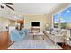 Bright living room featuring hardwood floors, cozy seating, large window and TV on the wall at 326 Roswell Se St # 406, Marietta, GA 30060